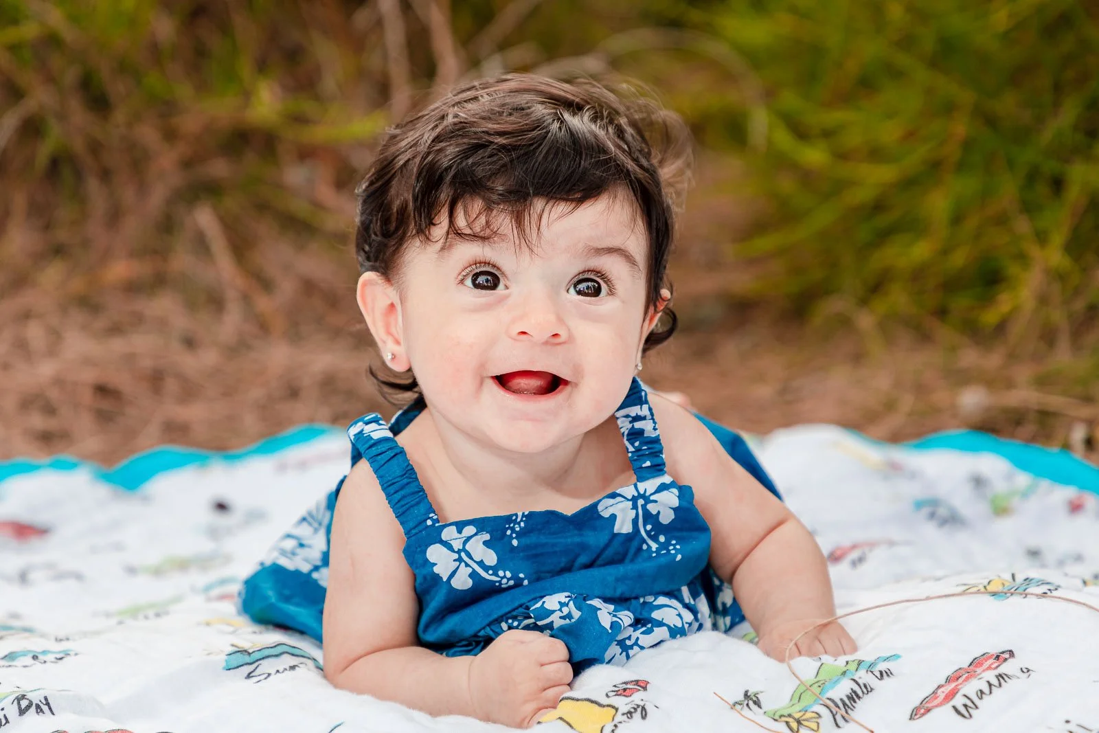 cute baby girl on blanket family portrait