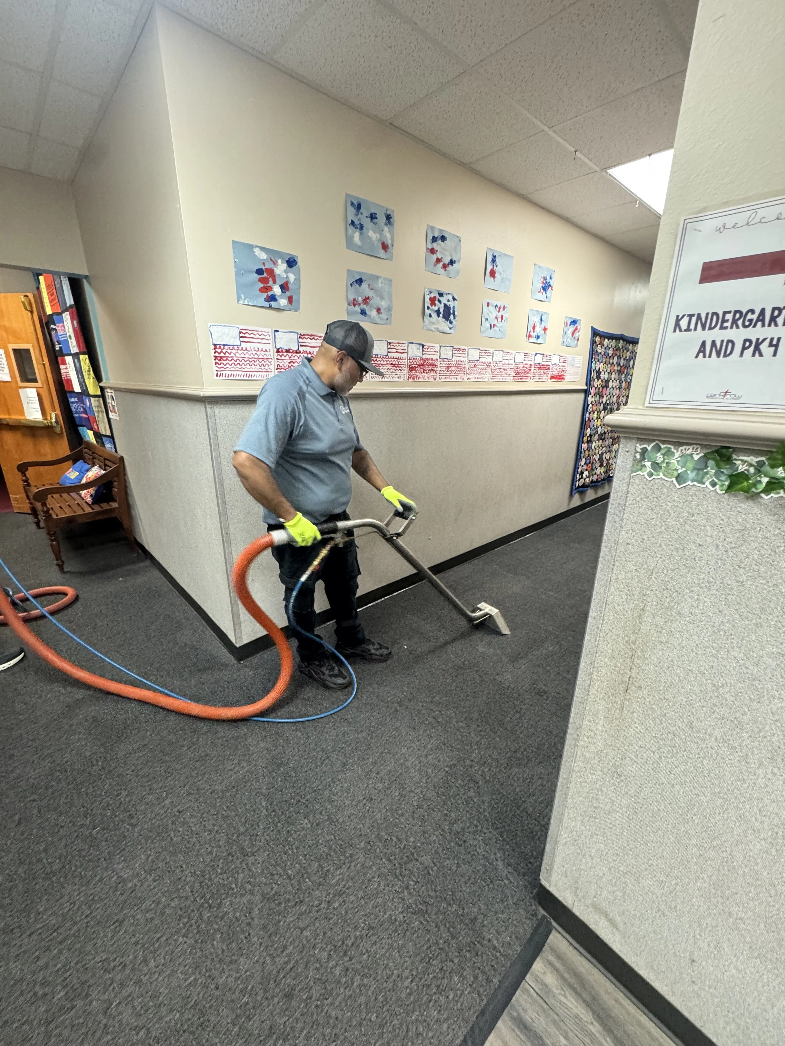 "EZ PRO technician providing commercial carpet cleaning services for a DFW area office building."