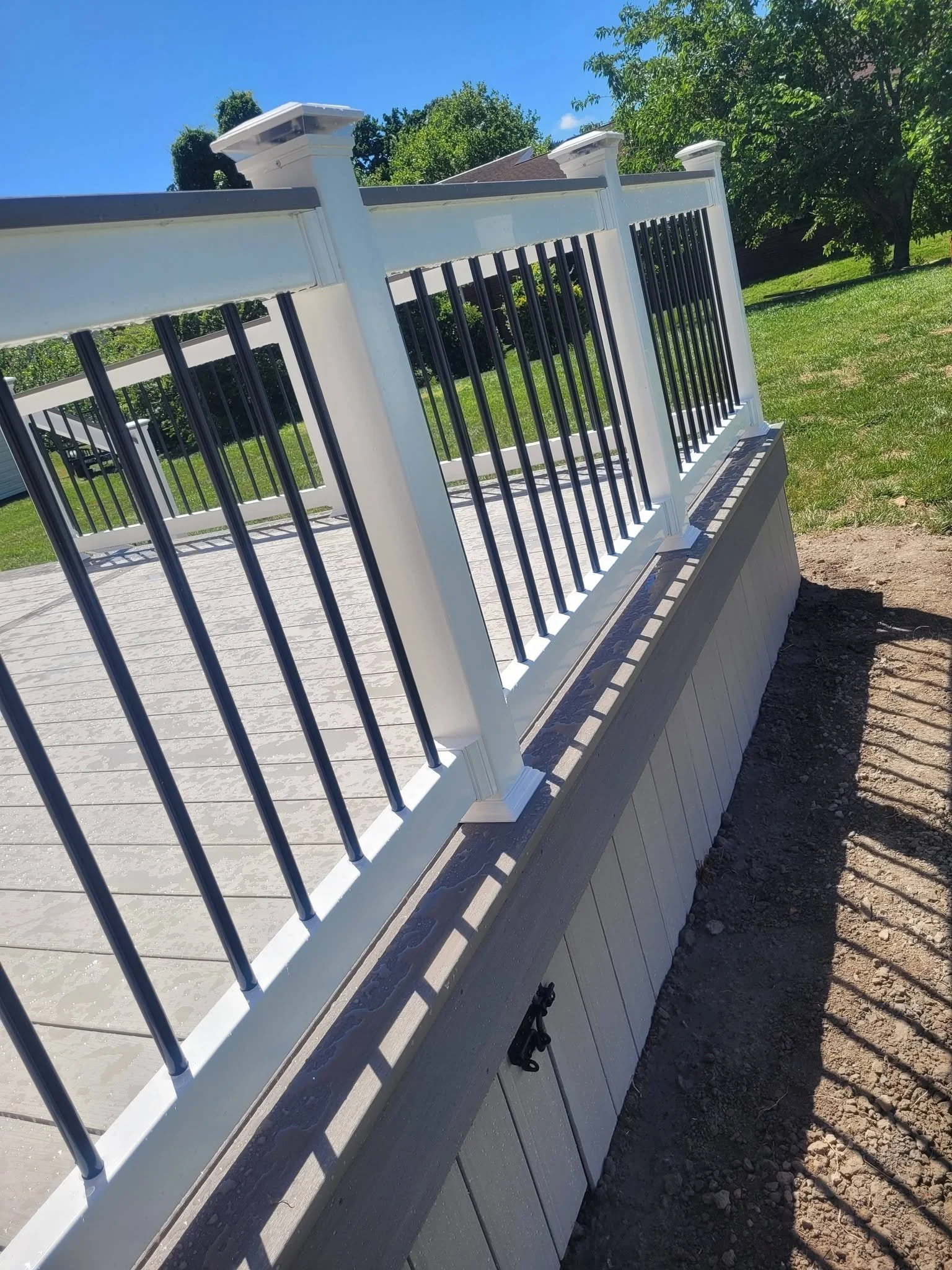 PVC Decking w/ White Vinyl Railings w/ Black Aluminum Balusters