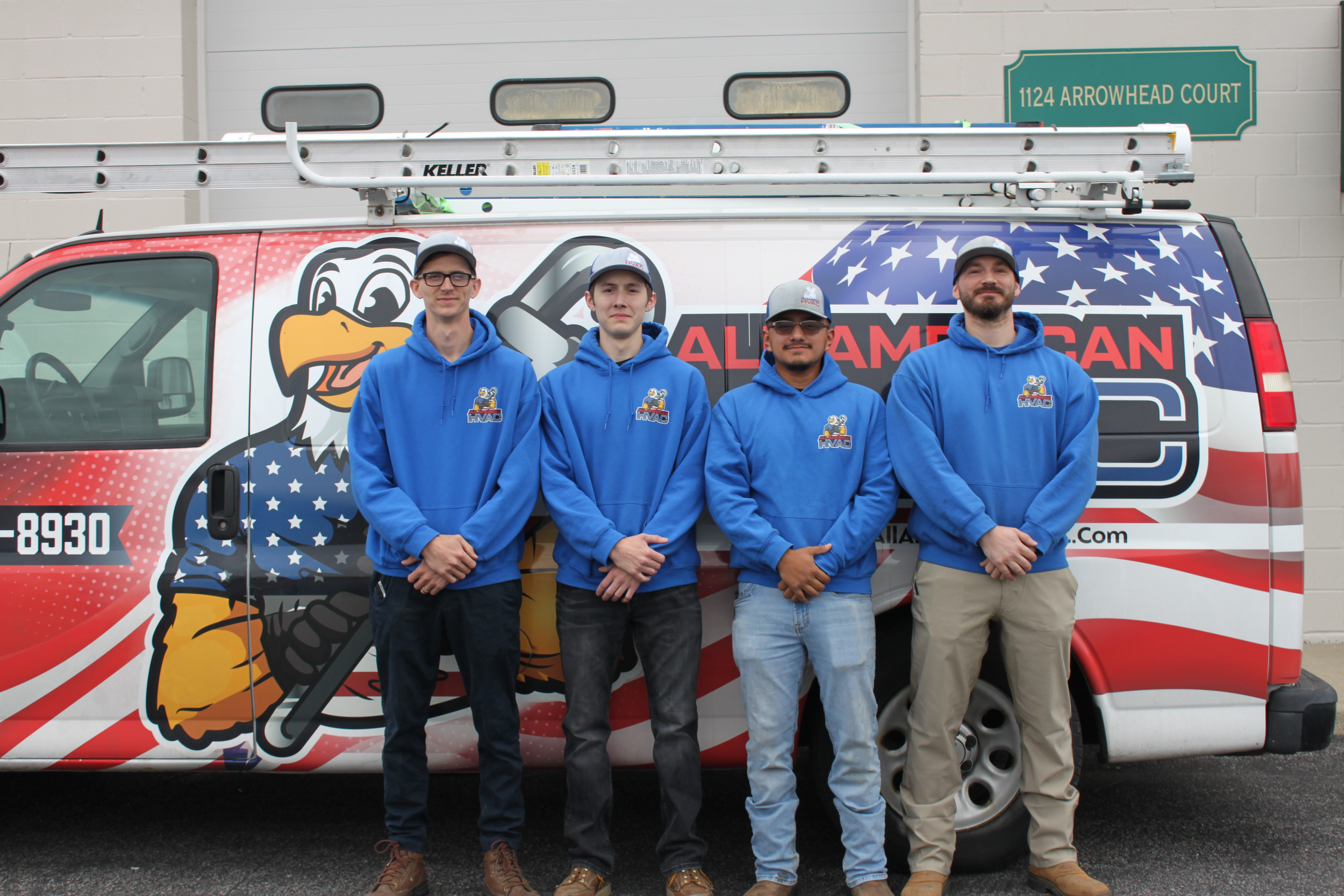 Call All American HVAC team standing in front of company service van
