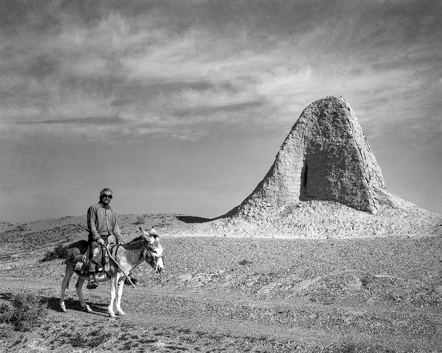 A camel herder riding a donkey in search of camels, Gaotai, Gansu, 2009