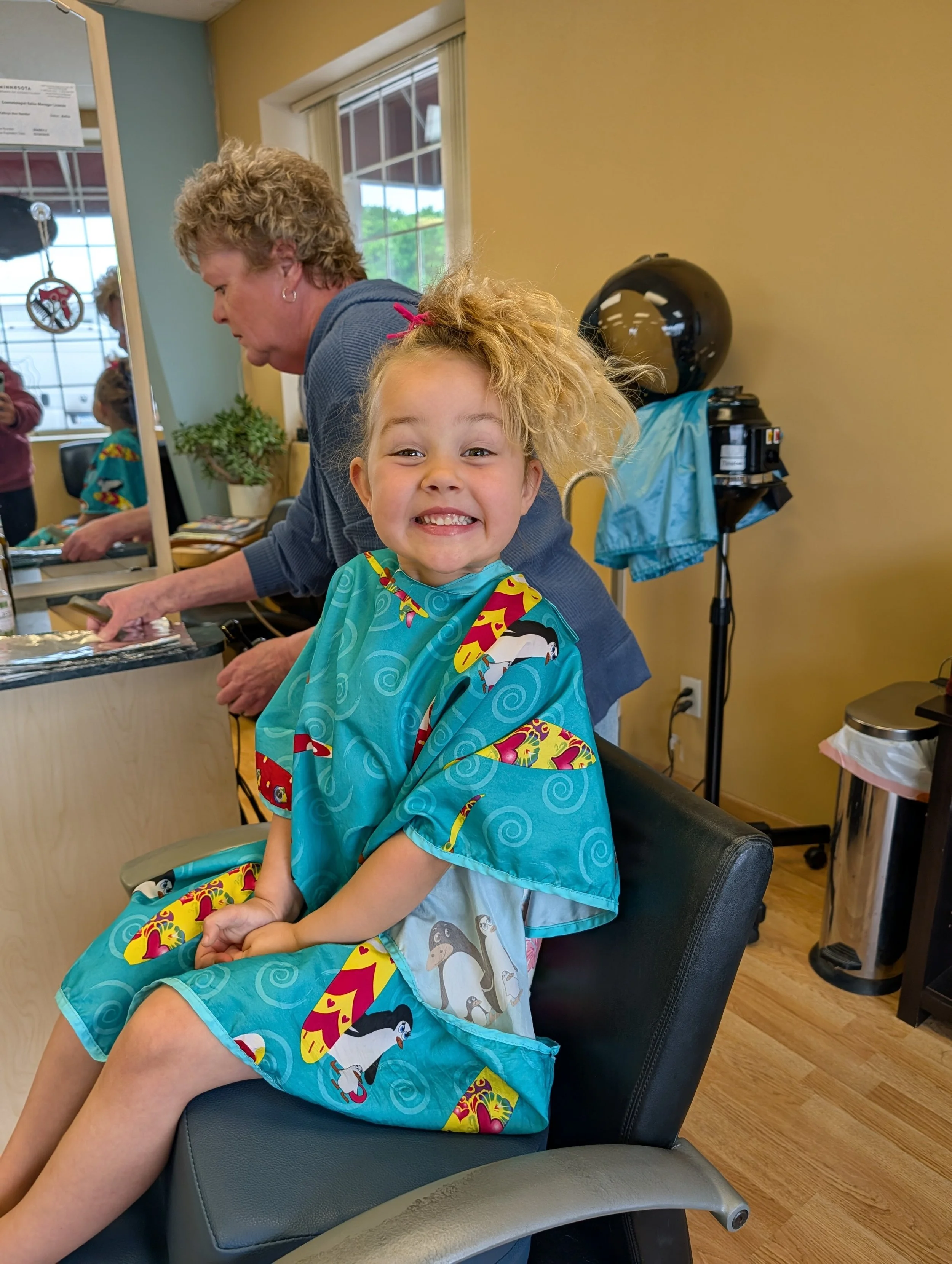 Stylist working with a client at Cypress Salon