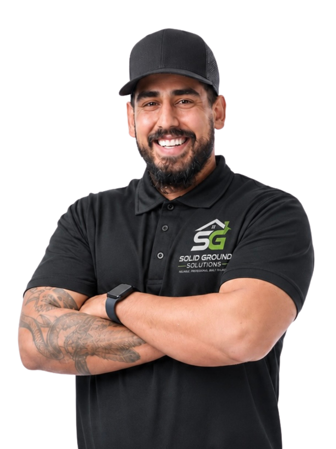 A smiling man with a beard and tattoos on his right arm, wearing a black hat and a black polo shirt with a logo that says 'Solid Ground Solutions'.