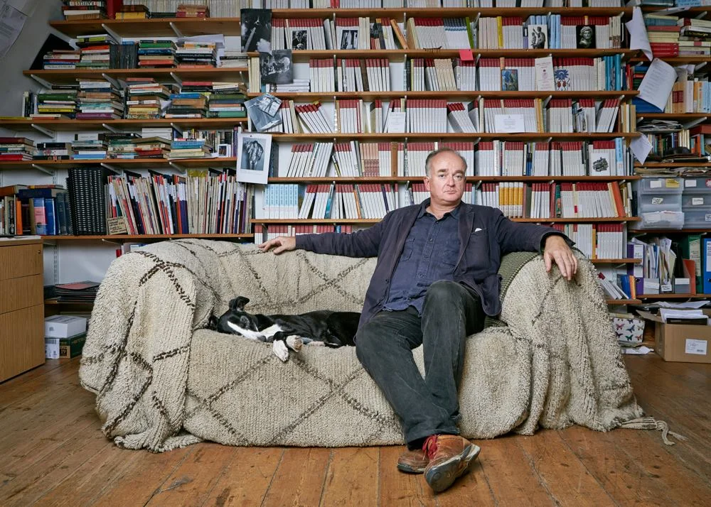Barnaby Rogerson, publisher, with Bianca in the Eland office on Exmouth Market