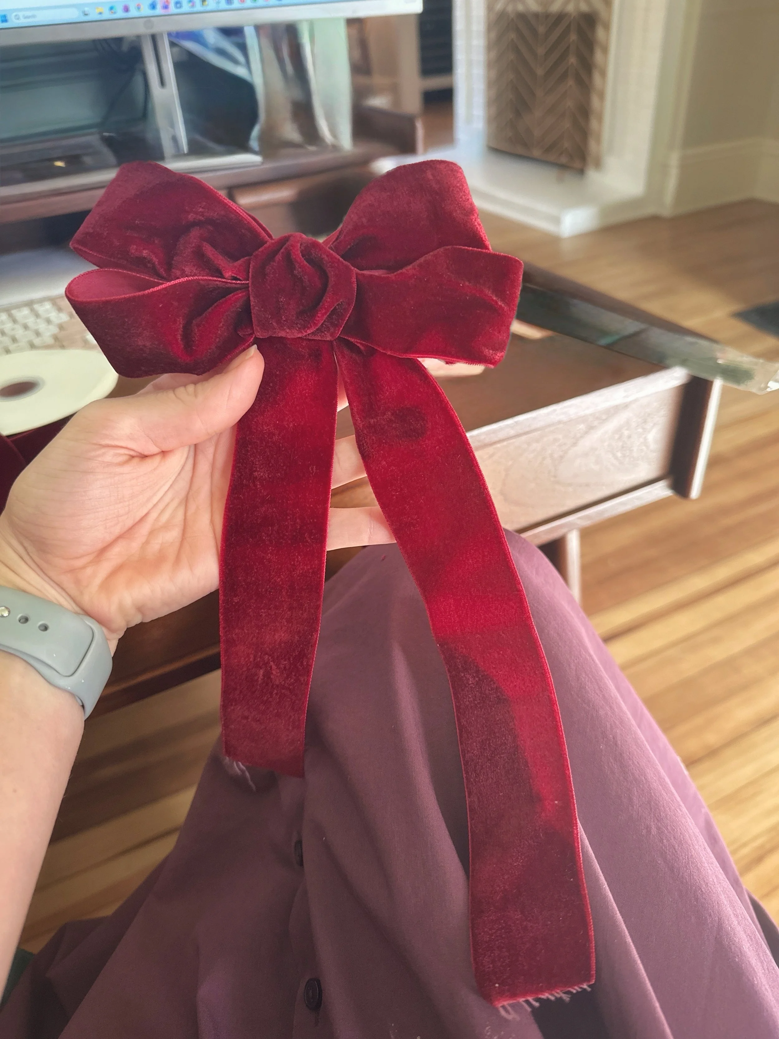 ribbon_burgundy-bow-in-hand-desk_DETAIL.jpg