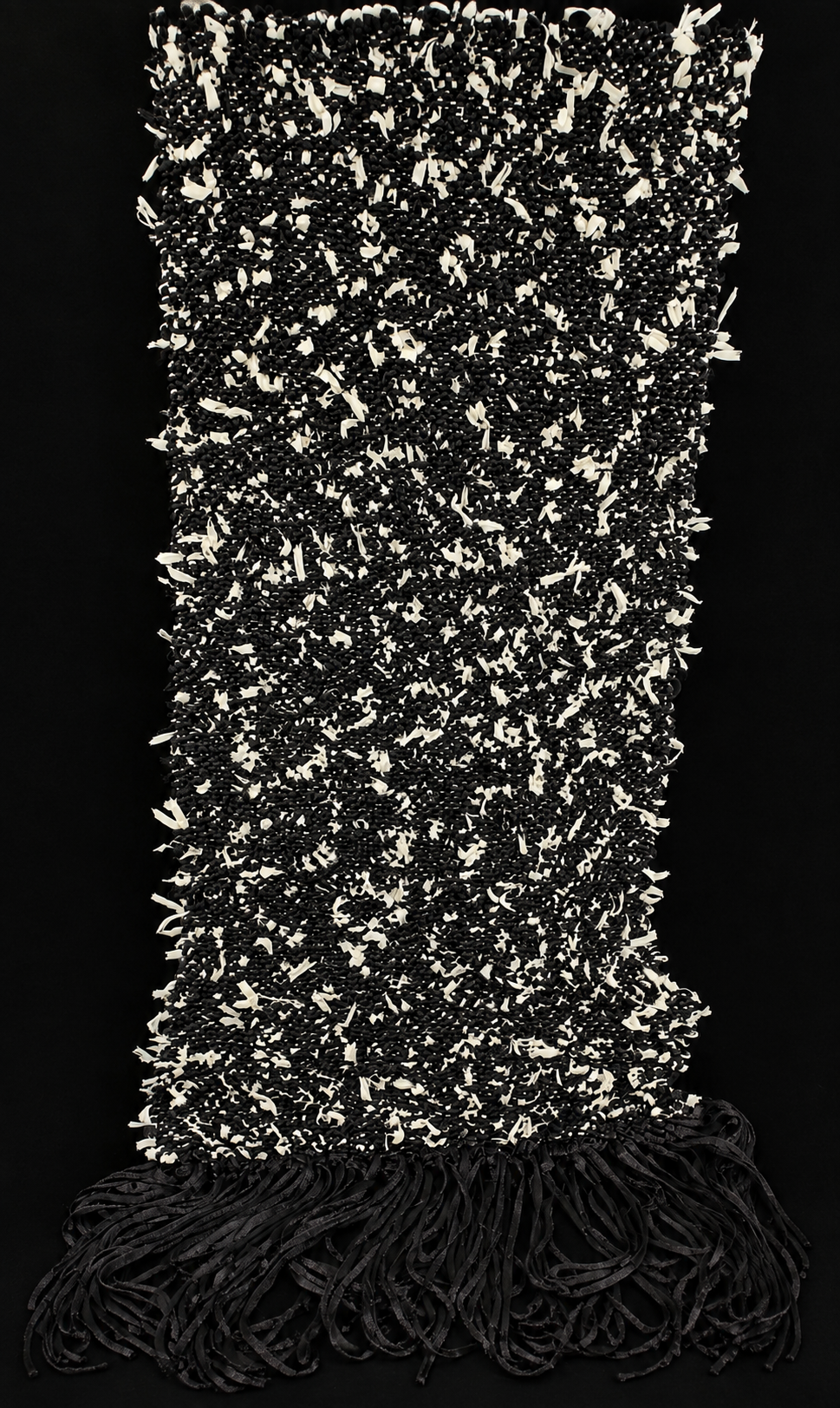 Confluence

Confluence is a one-of-one wearable work constructed through the accumulation and intertwining of linear elements. Mother-of-pearl, glass beads, and simulated pearls move through cotton-blend thread, creating a shifting, sculptural form t