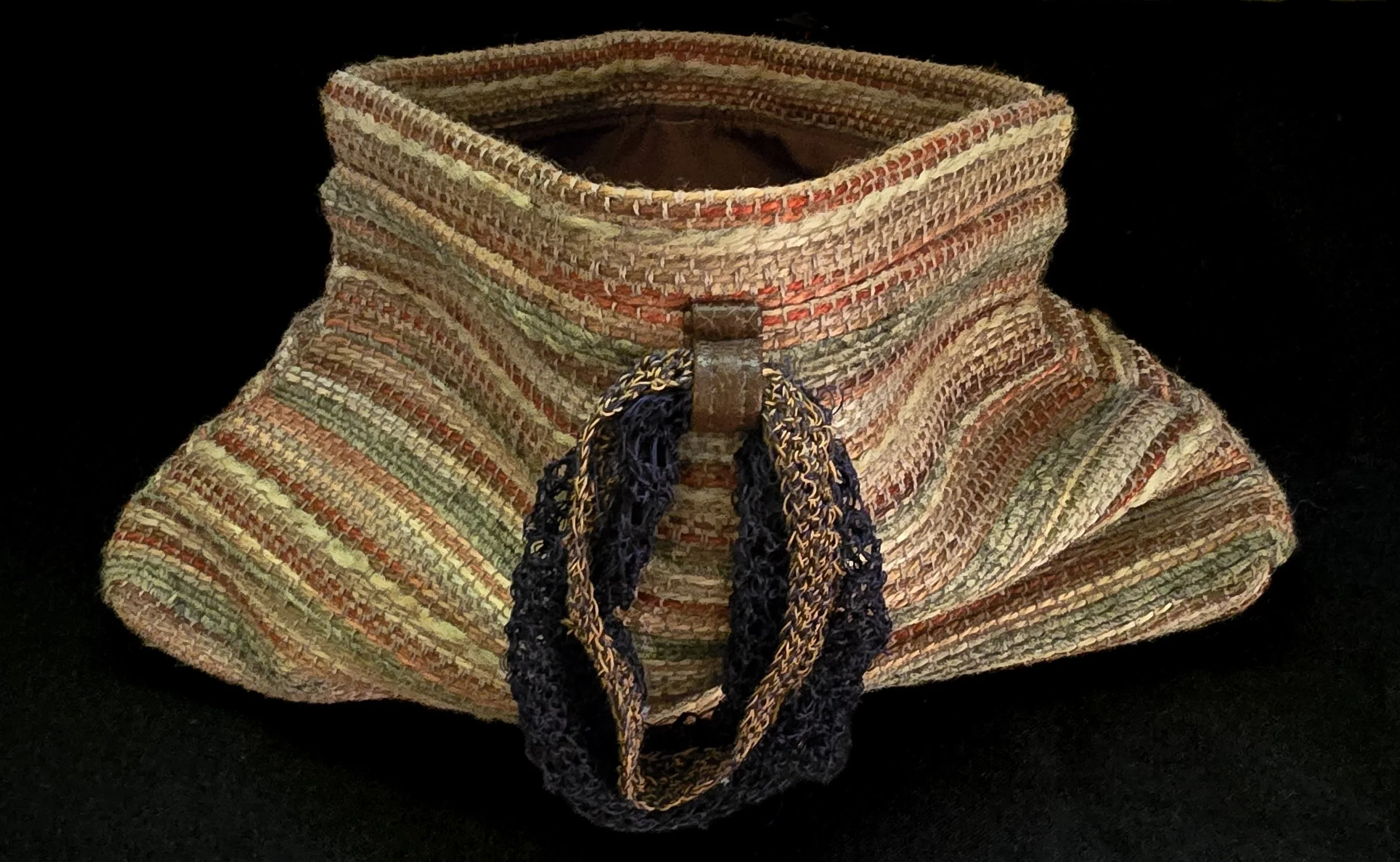 Repose

Repose is a one-of-one wearable work constructed through the accumulation of color, texture, and woven form. Its sculptural body expands outward from a compact opening, creating an object that sits somewhere between vessel, accessory, and tex