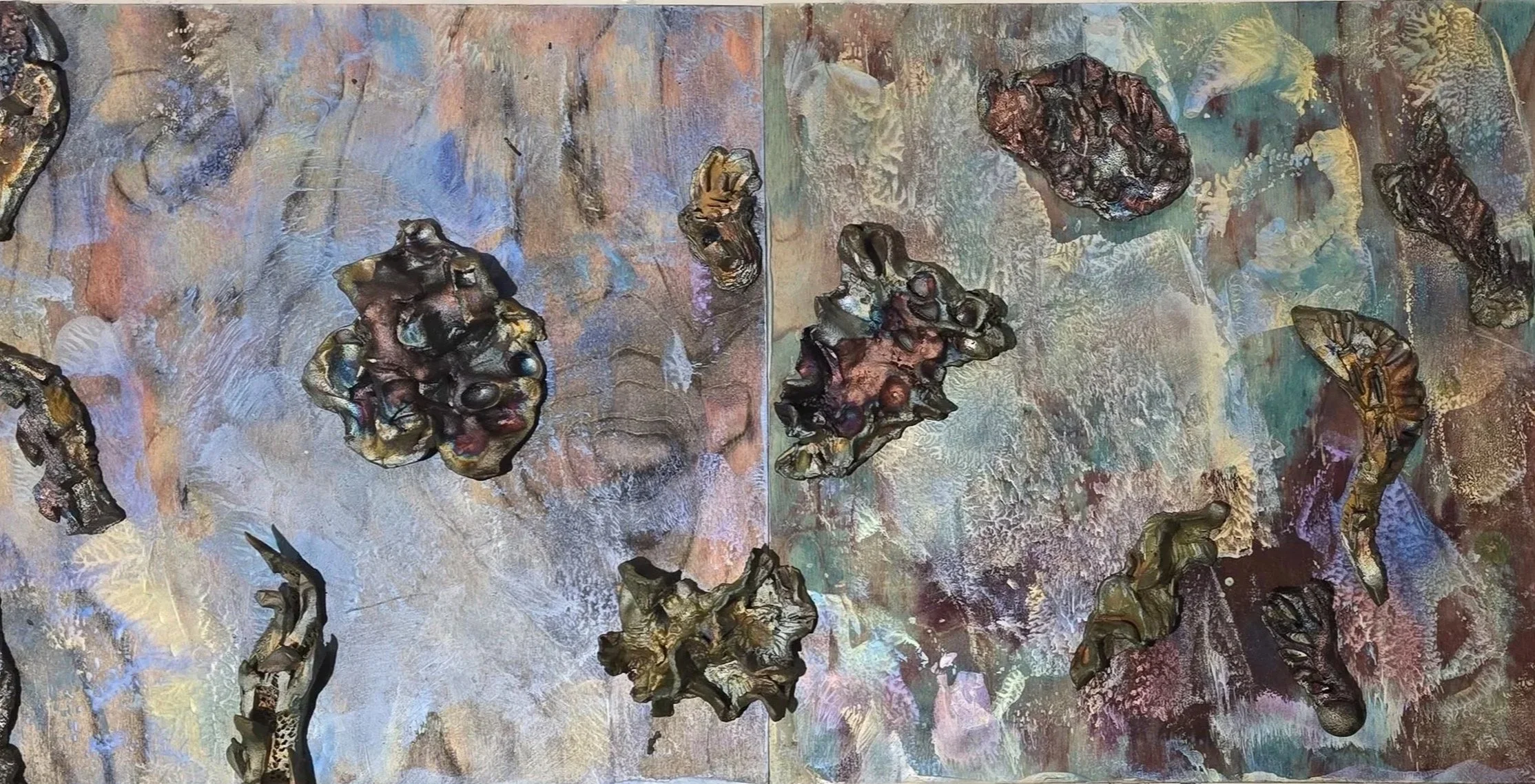 Abstract textured painting with dark, irregular shapes resembling rocks or organic forms on a multicolored background of pastel shades, with a rough, layered surface.