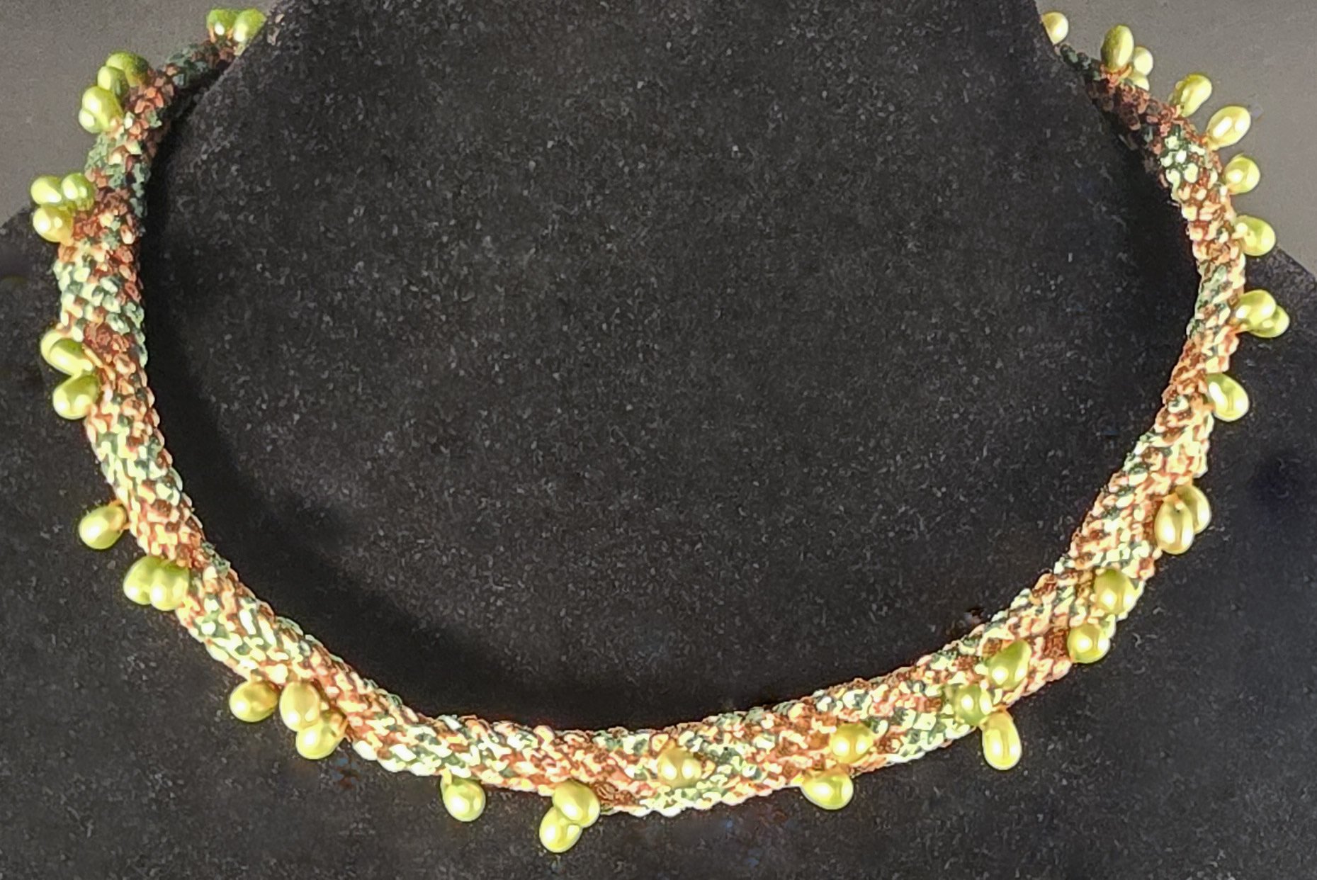 Talisman

Talisman is a one-of-one wearable work rooted in the ancient Japanese braiding practice of Kumihimo. The delicate hollow braid is constructed on a marudai using Japanese threads hand-dipped in metallics, creating a form that carries both li