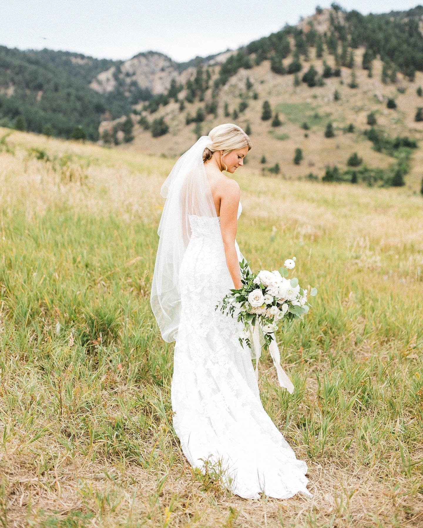 Looking back at 2021 and looking forward to 2022. Excited to see what comes from it! 🥂

Photo: @coloradoweddingproductions 
H&amp;MU: @hdhairandmakeup 
Florals: @blushandbayfloral 
Dress: @daniwestbridal 
Planning: @asyouwishco 

#wedding #weddingdr