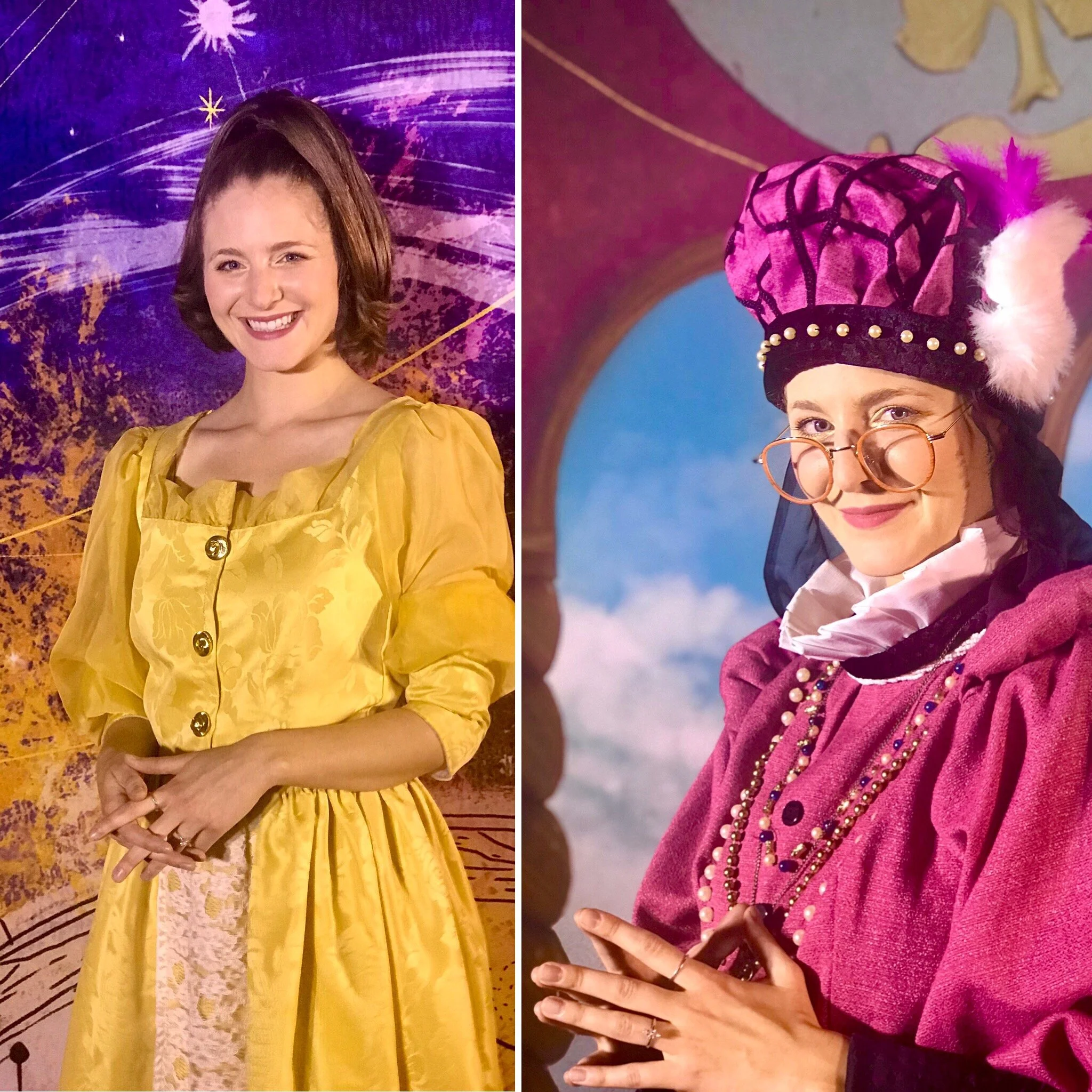 Two women dressed in colorful costumes, one in a yellow dress and the other in a pink outfit, standing in front of a decorative background and a backdrop of a telescope. The woman in yellow has short brown hair and is smiling, while the woman in pink
