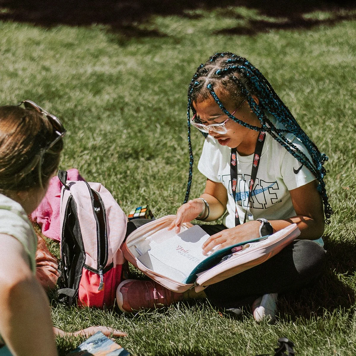 A student reading and discussing Scripture with her small group