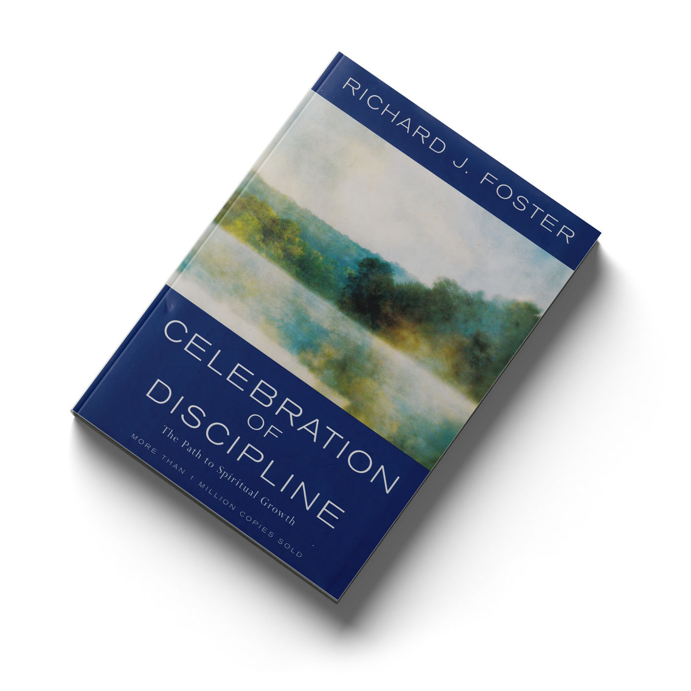 Book titled 'Celebration of Discipline' by Richard J. Foster, featuring a watercolor landscape on the cover.