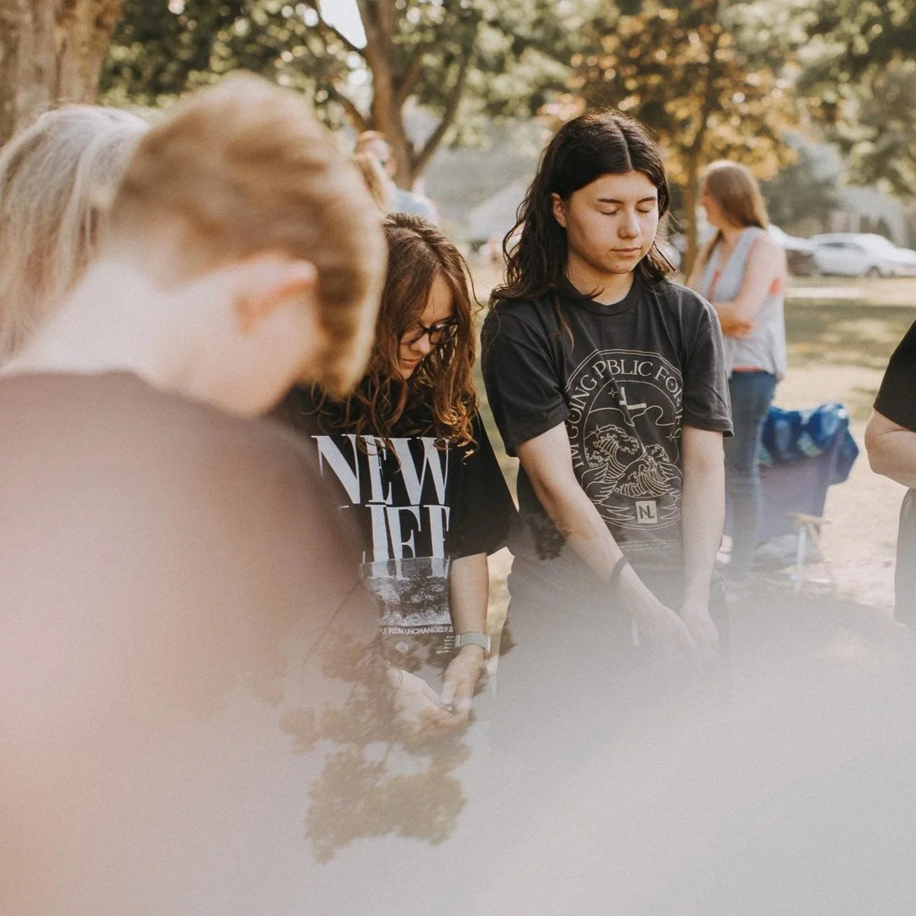 People praying and celebrating during a New Life Church baptism