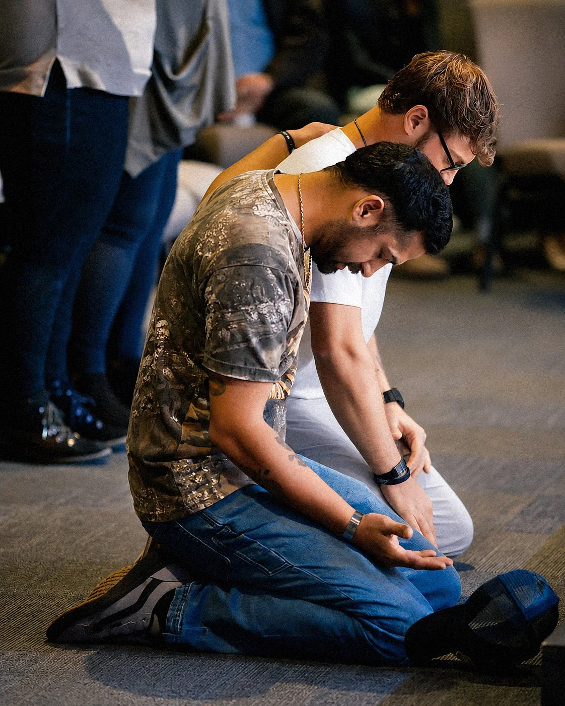 People praying together at New Life Church in Wayland