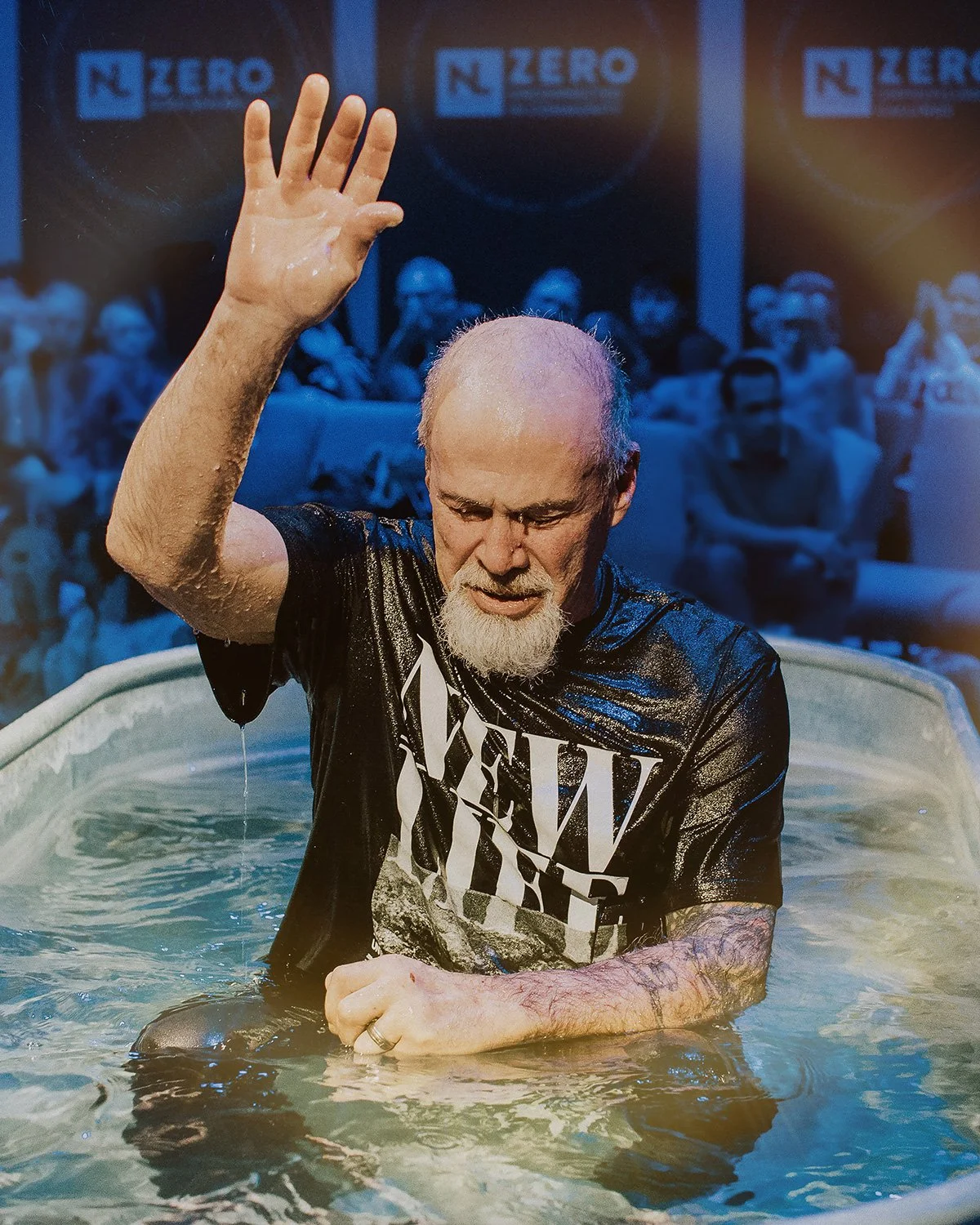A man celebrating his baptism at New Life Church