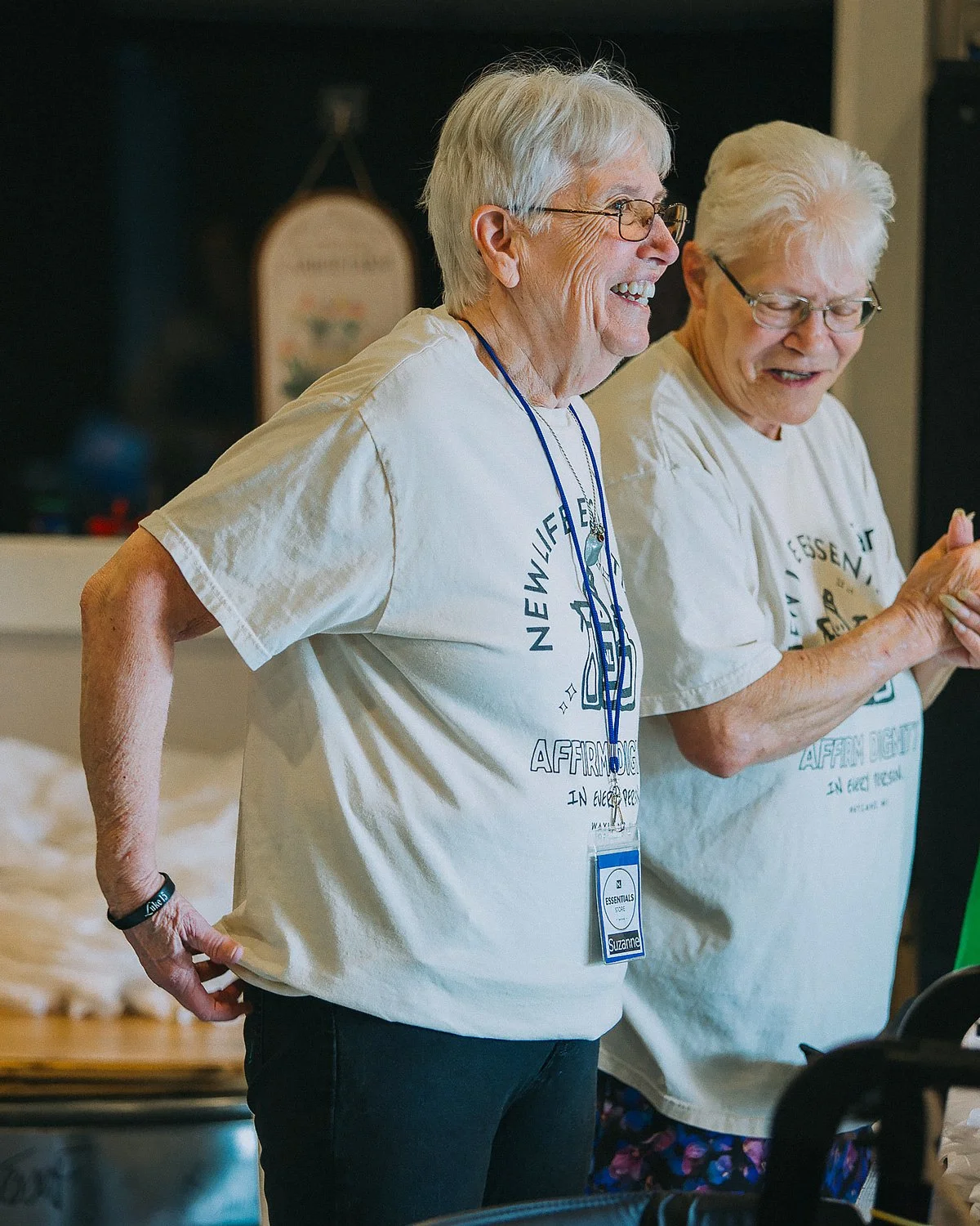 Volunteers serving together at The Essentials Store