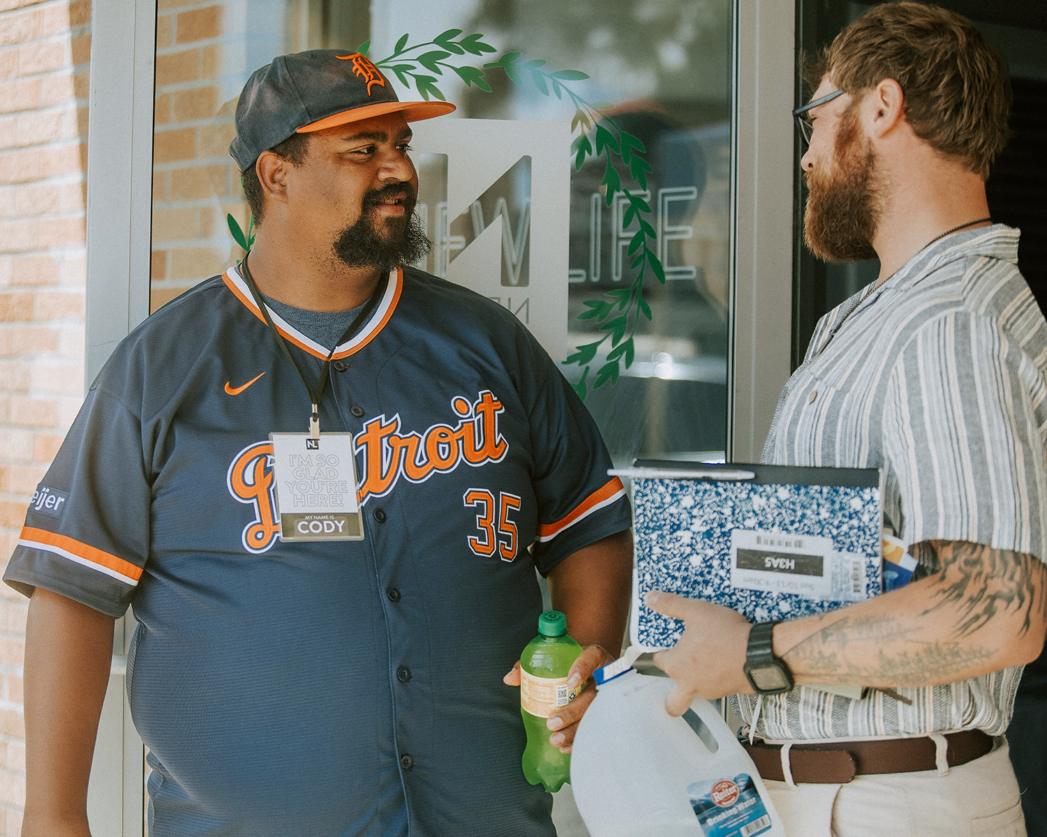 A New Life Church volunteer welcoming a guest outside