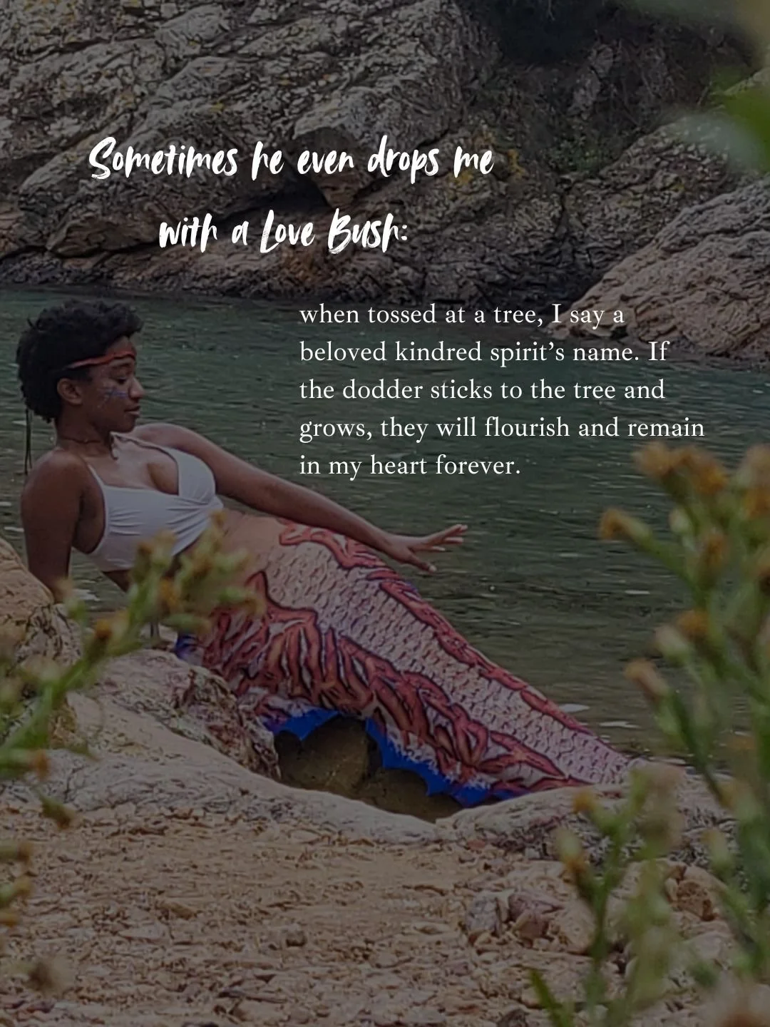 Mermaid Andrina relaxes on a rock near ocean