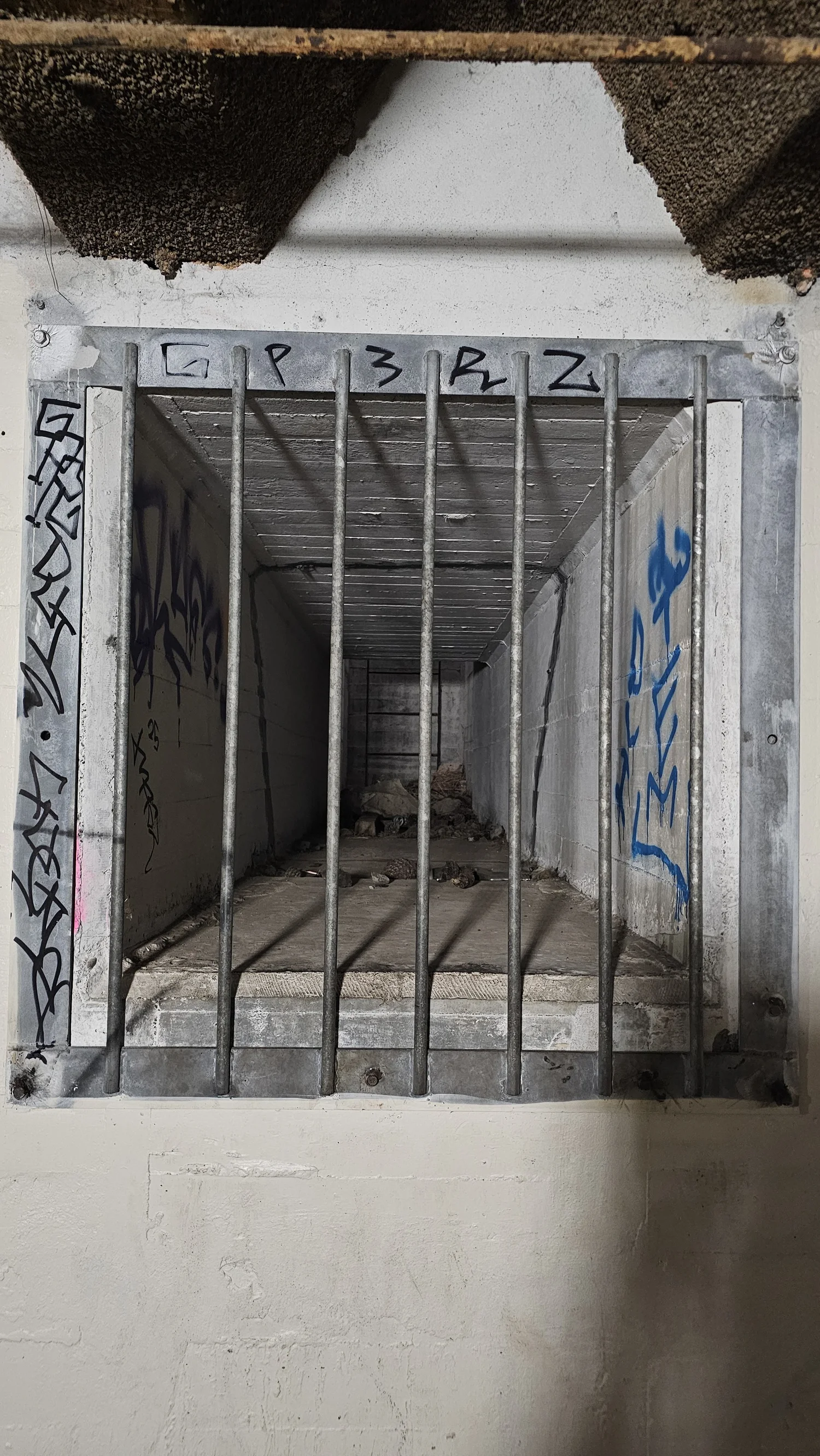 Barred historic tunnel inside the Godley Head fort