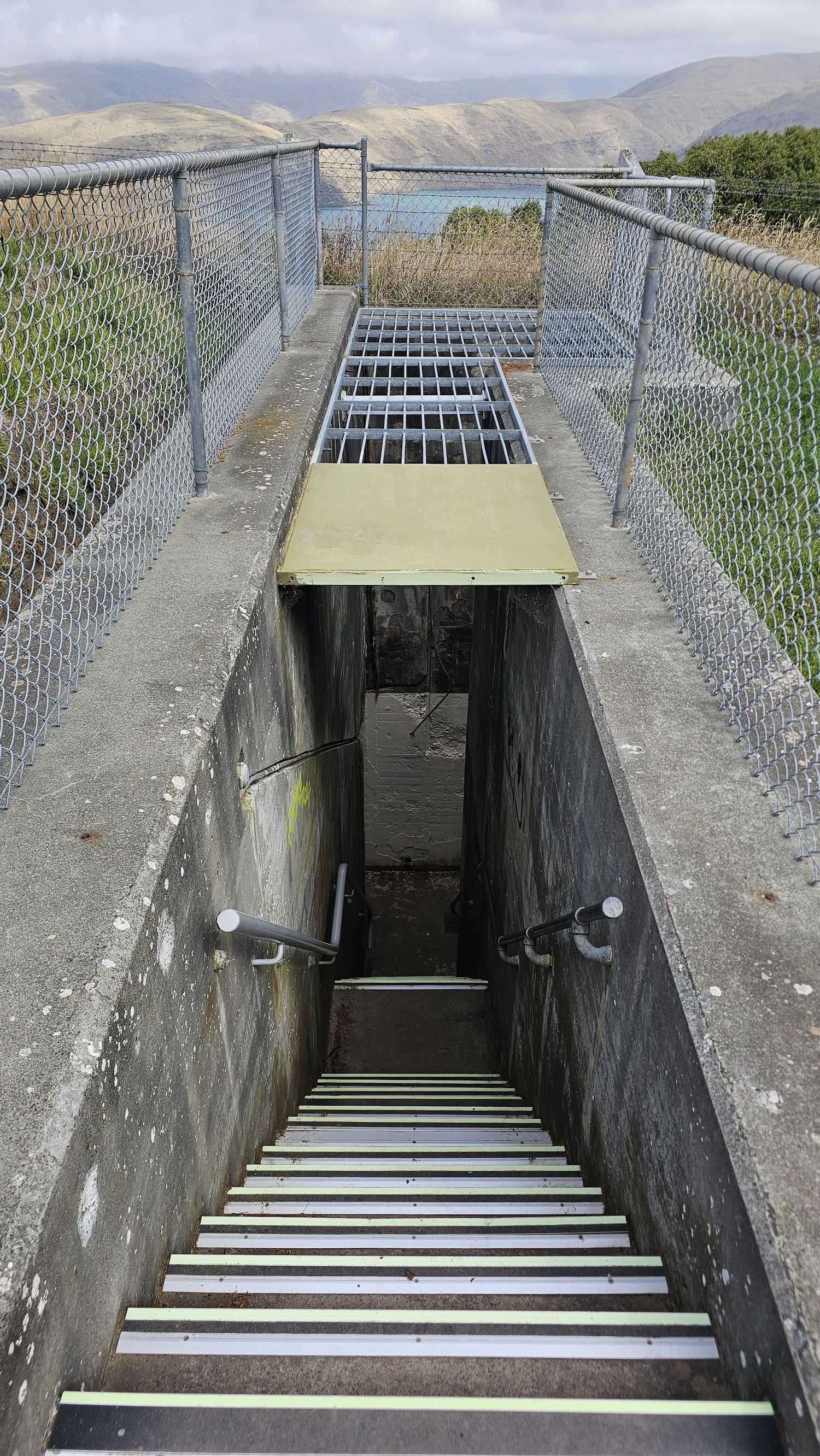 Steep stairs leading underground at Godley Head