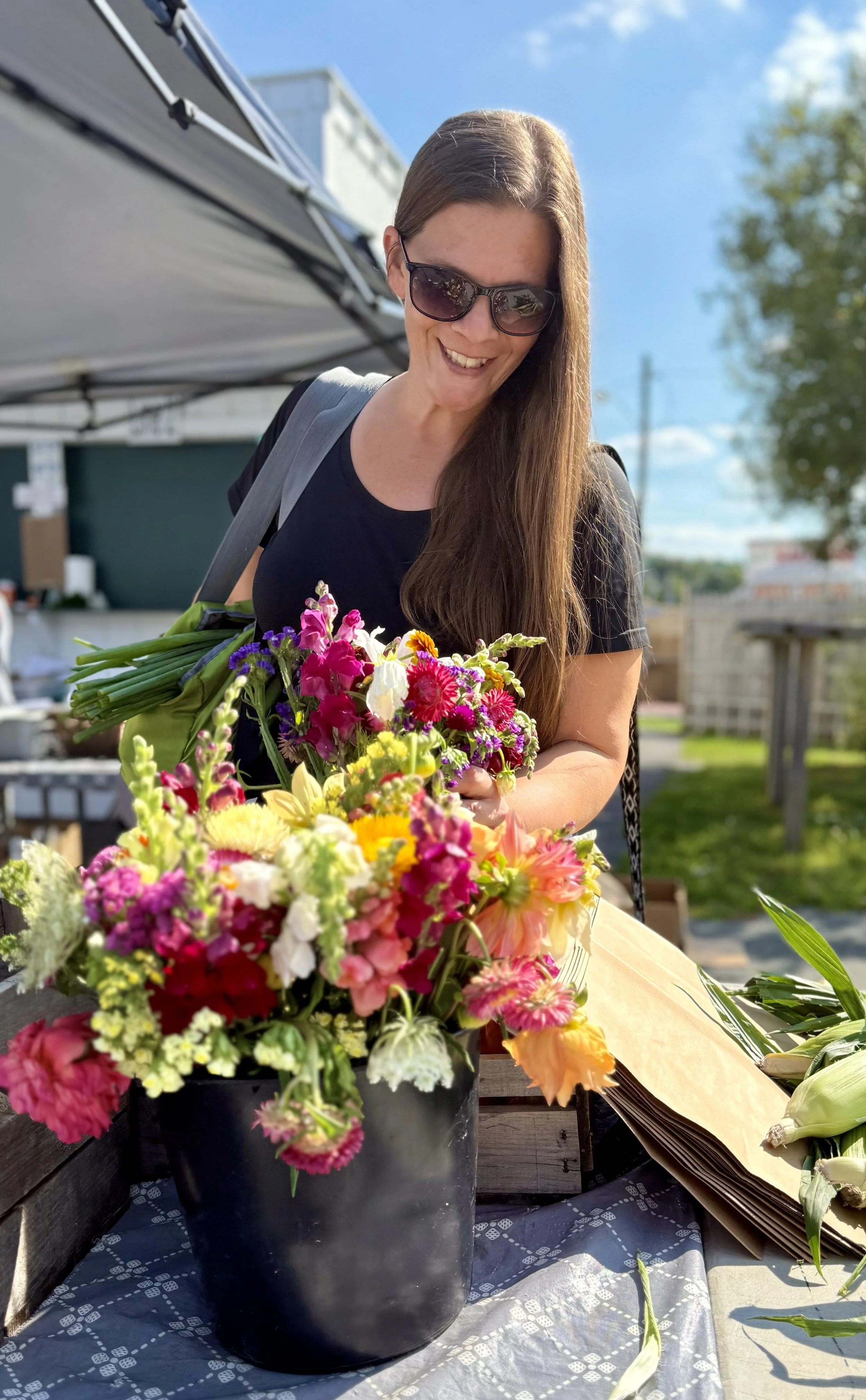 Ann at a farmers market, mid-errand