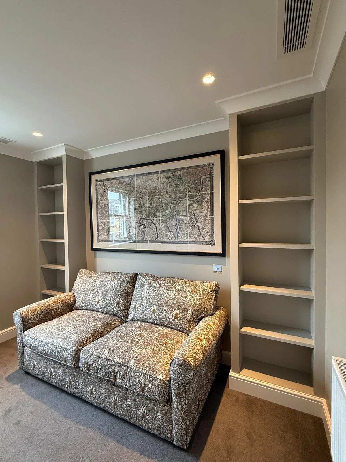 painted walls in earthy colours with build in shelving