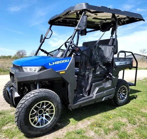 Blue gas golf cart with 2 bench seats, chrome wheels, side mirrors, horn, emergency flashers, and extended roof