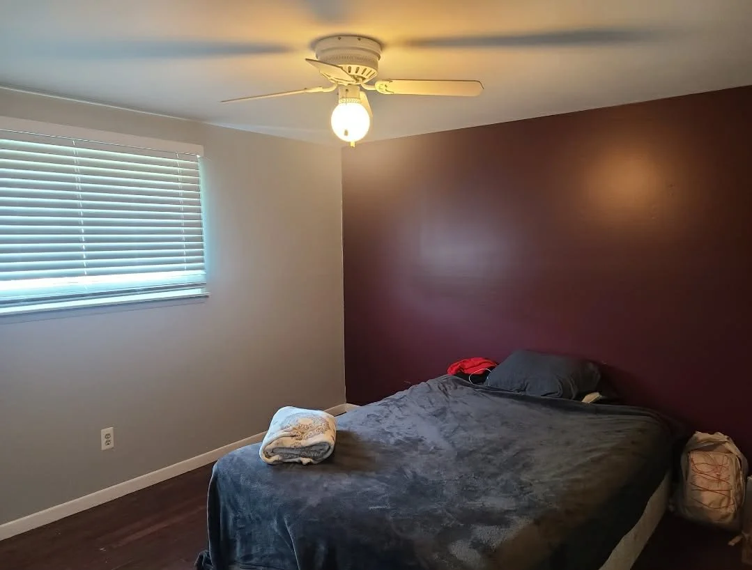 Bedroom with a bed, window with blinds, ceiling fan, and closet.