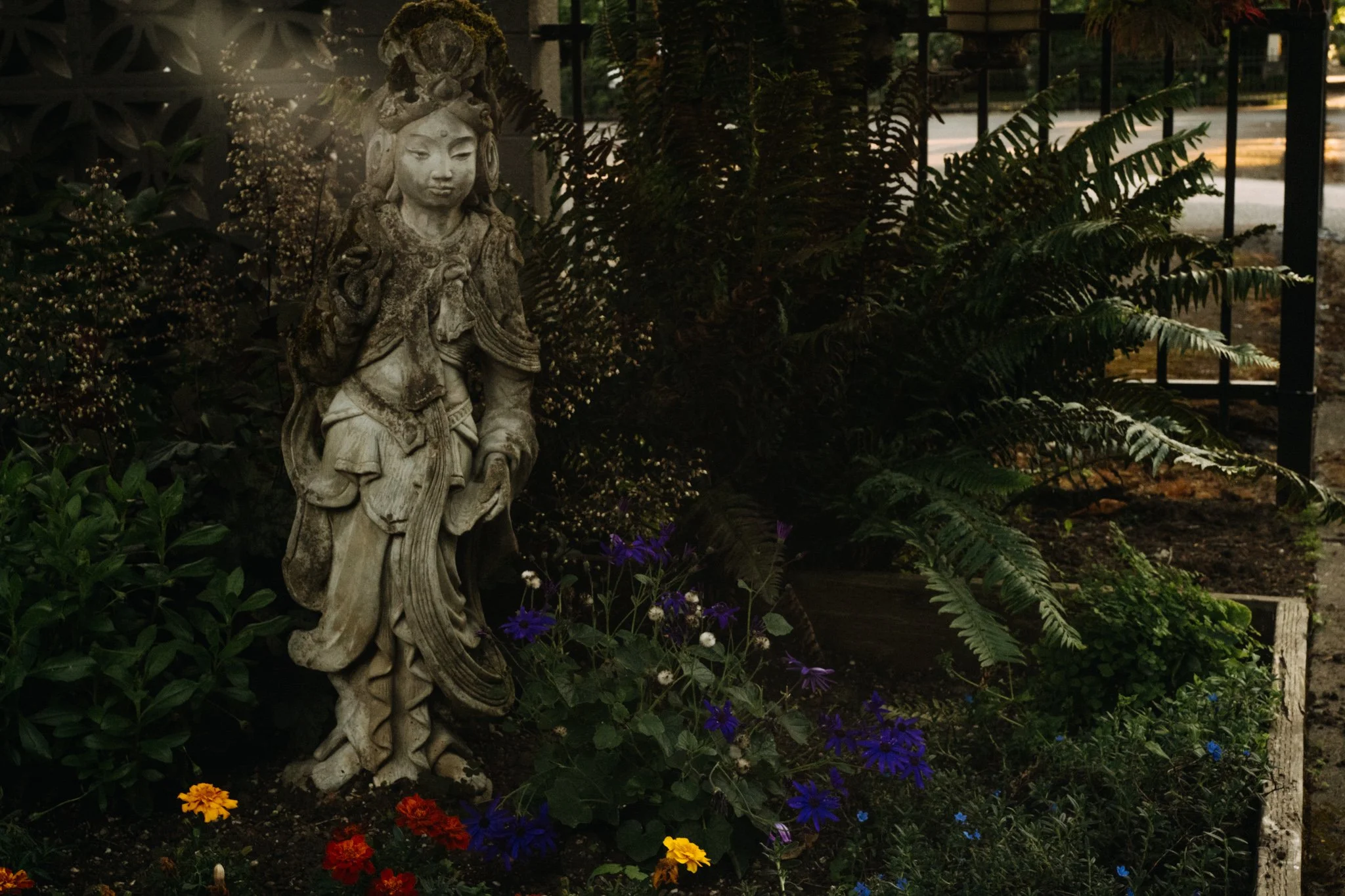 PNW  Asian statue in yard in Portland Oregon