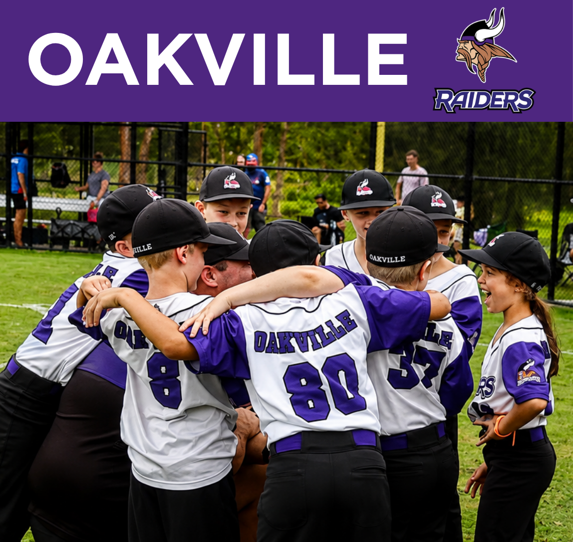 A group of young baseball players from Oakville, wearing purple and white uniforms with the team name on the back, are celebrating and hugging on a grassy field. Some players are smiling, and they are all wearing black caps with the Oakville logo. In the background, there are other people and a fence, with trees behind them.