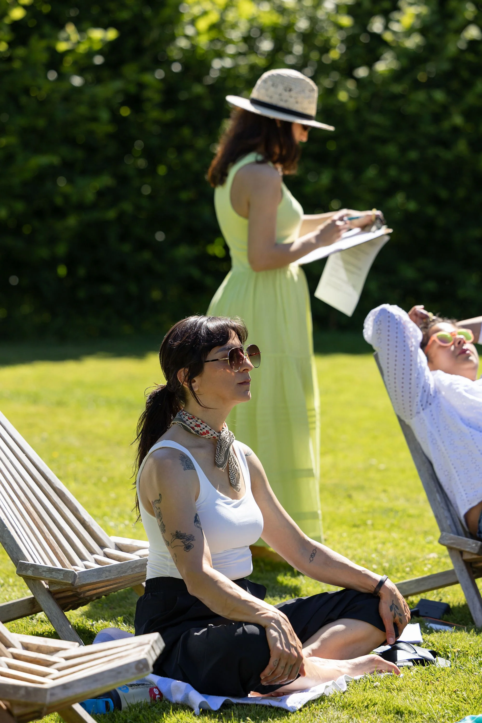 A retreat participant practicing mindfulness outdoors on the farm as part of a restorative experience for clinicians.