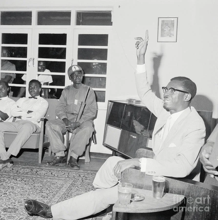 patrice-lumumba-holding-an-expulsion-bettmann.jpg