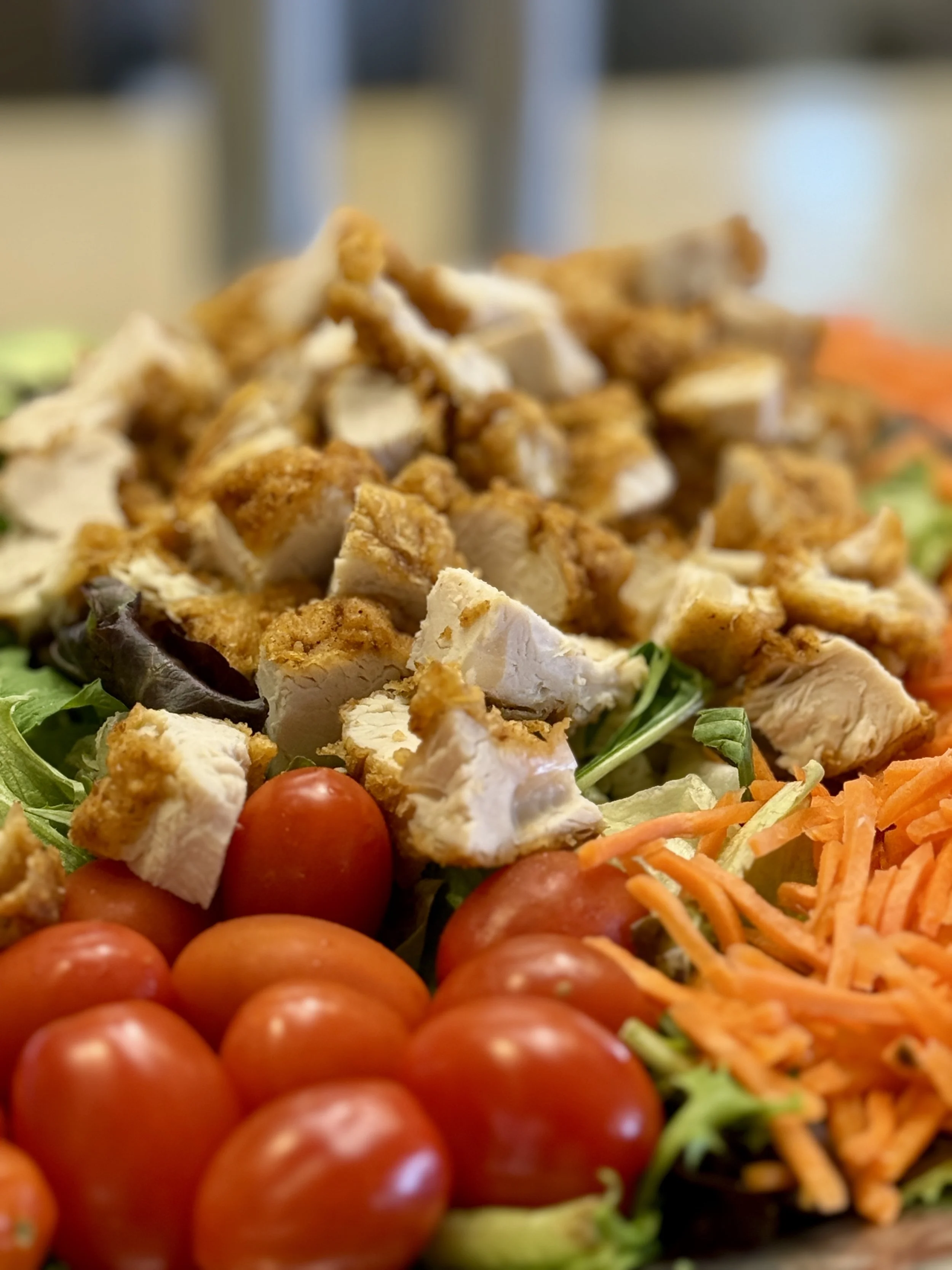Salad Arrangement with chicken, tomatoes, cheese, and lettucefor Lipscomb Dining