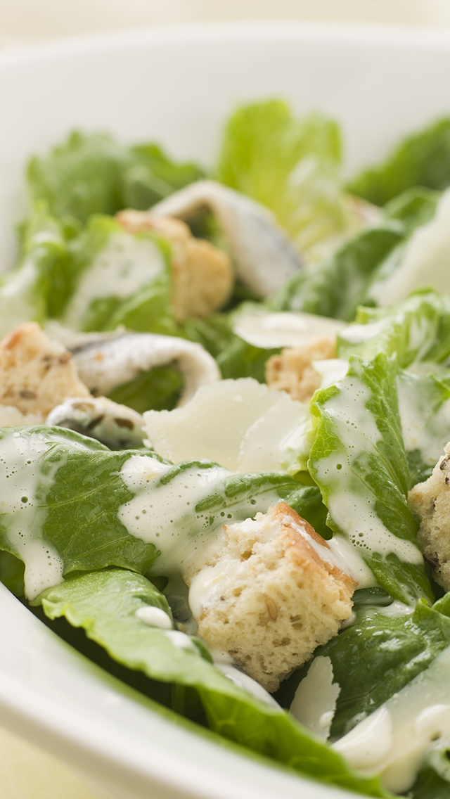 Caesar salad with romaine lettuce, croutons, parmesan cheese, and Caesar dressing