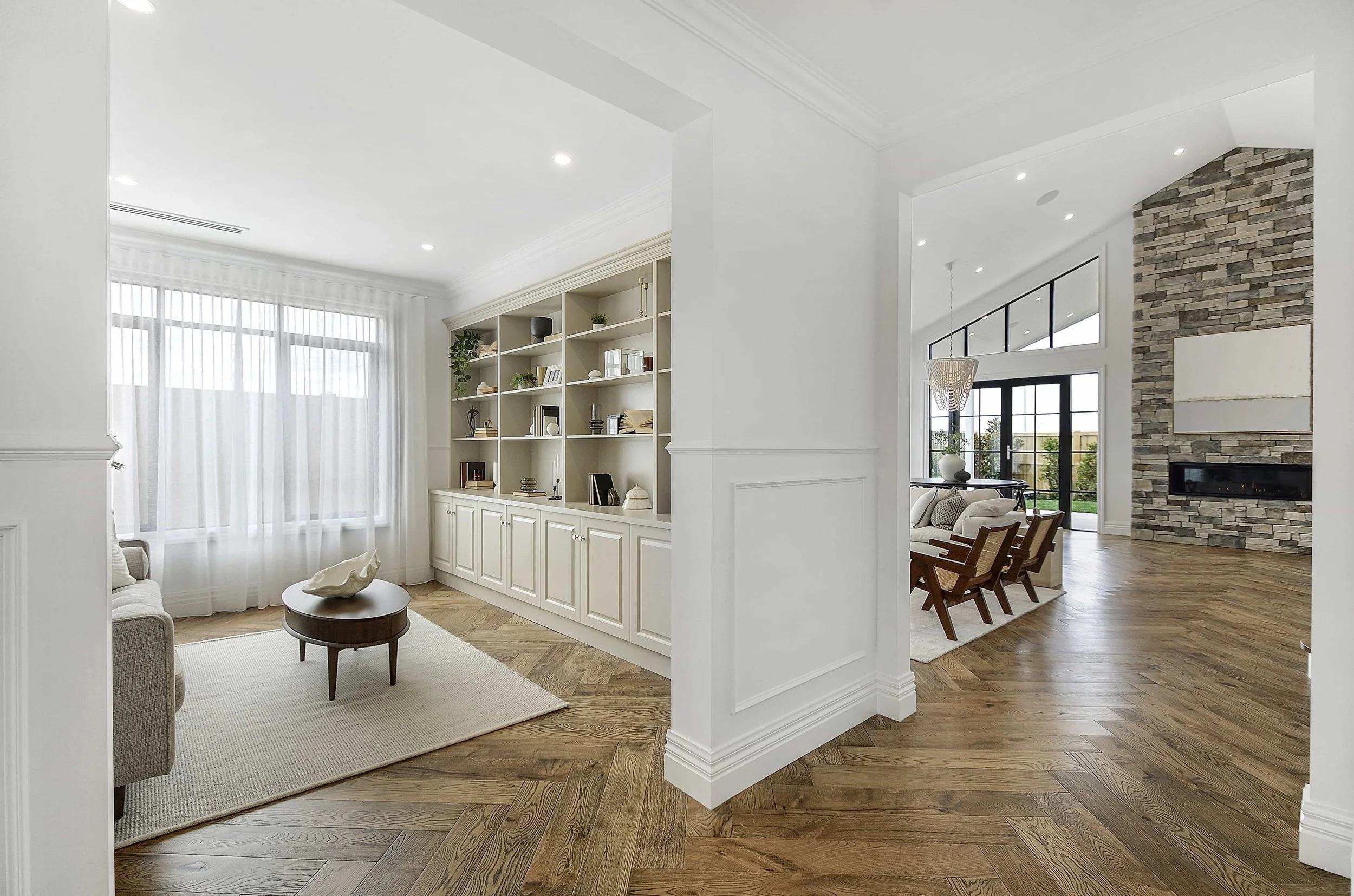 A luxury home with a formal sitting room and custom cabinetry.