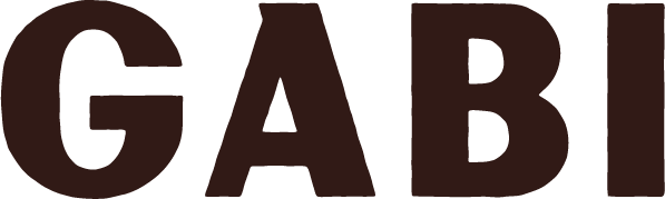 Close-up of the word "GABI" written in large, bold, dark letters on a black background.