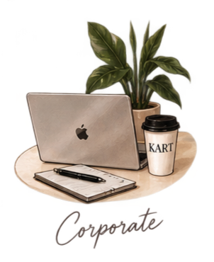 Laptop, notebook, pen, and a to-go coffee cup on a round table with a potted plant in the background.