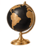 A decorative globe with black and gold continents on a gold stand.
