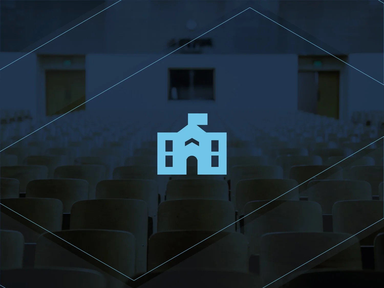 Rows of empty chairs in an auditorium with a blue icon of a building in the foreground.