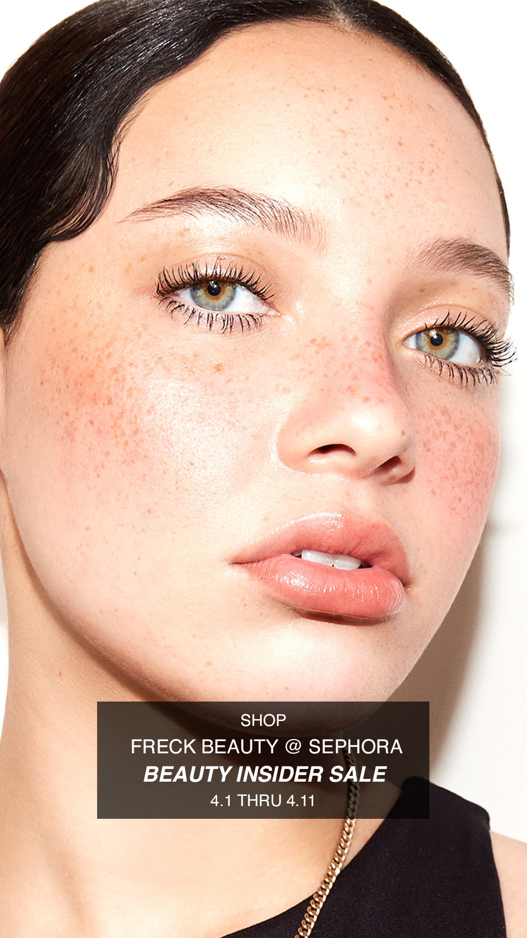 Close-up of a woman with clear skin, light makeup, brown hair, and freckles, promoting Sephora's beauty insider sale.