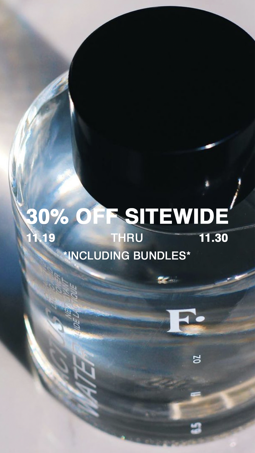 A close-up of a clear plastic water bottle with a black cap, with promotional text overlaid that announces 30% off sitewide from November 19 to November 30, including bundles.