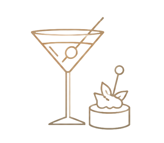 A cocktail glass with a pink and green drink, a lemon peel garnish, and a straw, alongside a bowl of popcorn with a lemon slice and a straw.