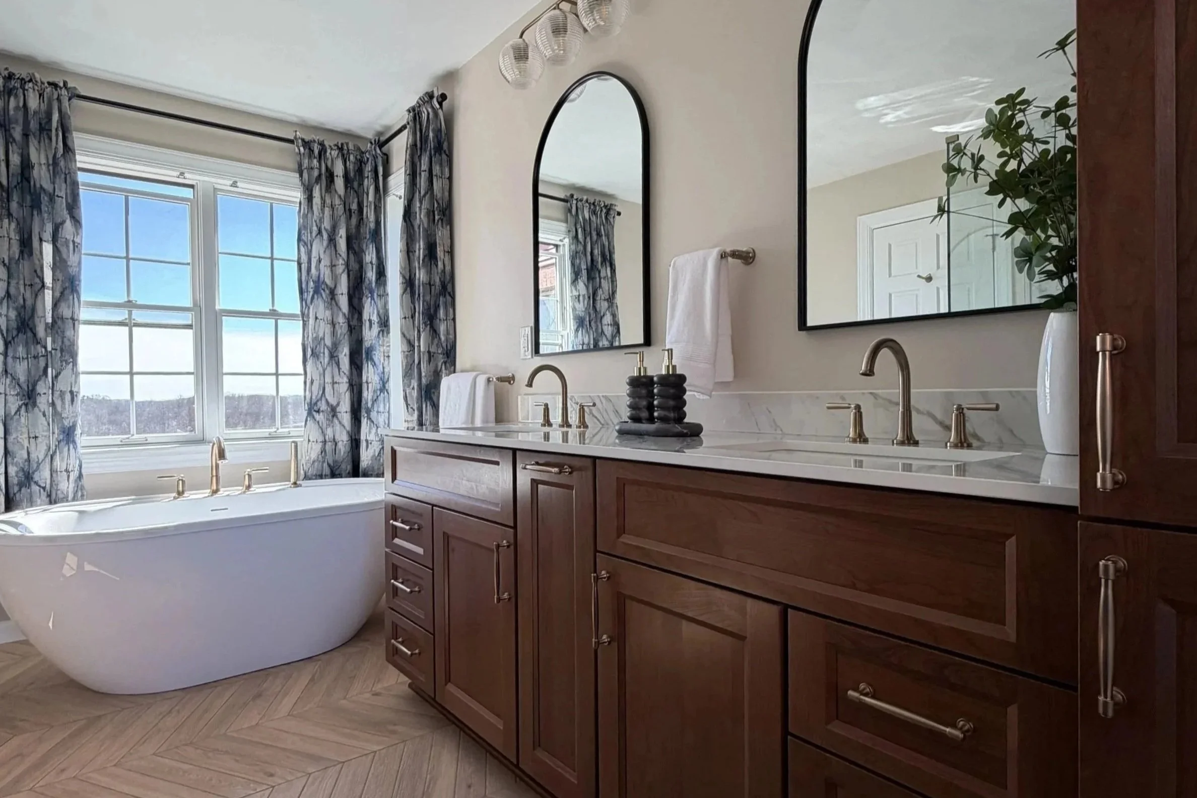 Classic bathroom with cherry cabinets and soaking tub in Butler