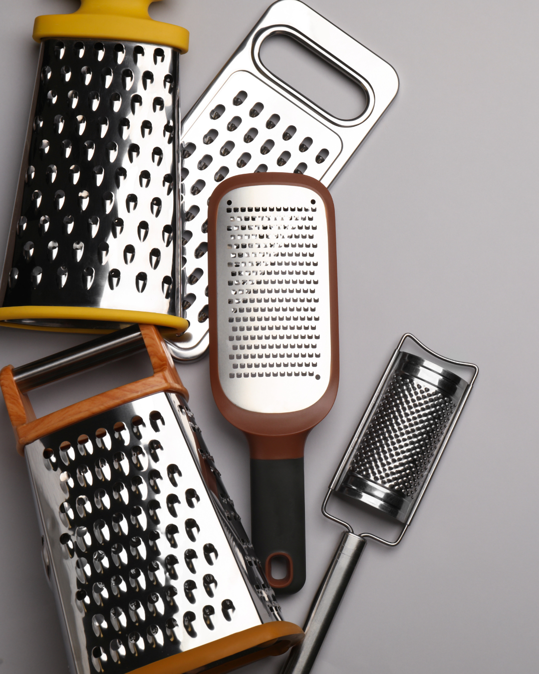 Graters and shredders for cheese and vegetables.