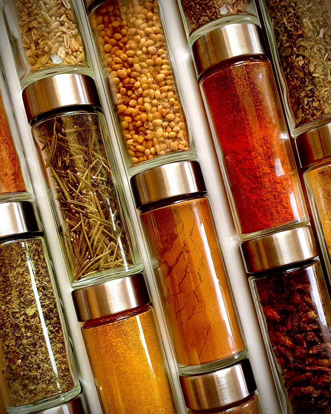 Spice bottles for storing dried herbs and seasonings.