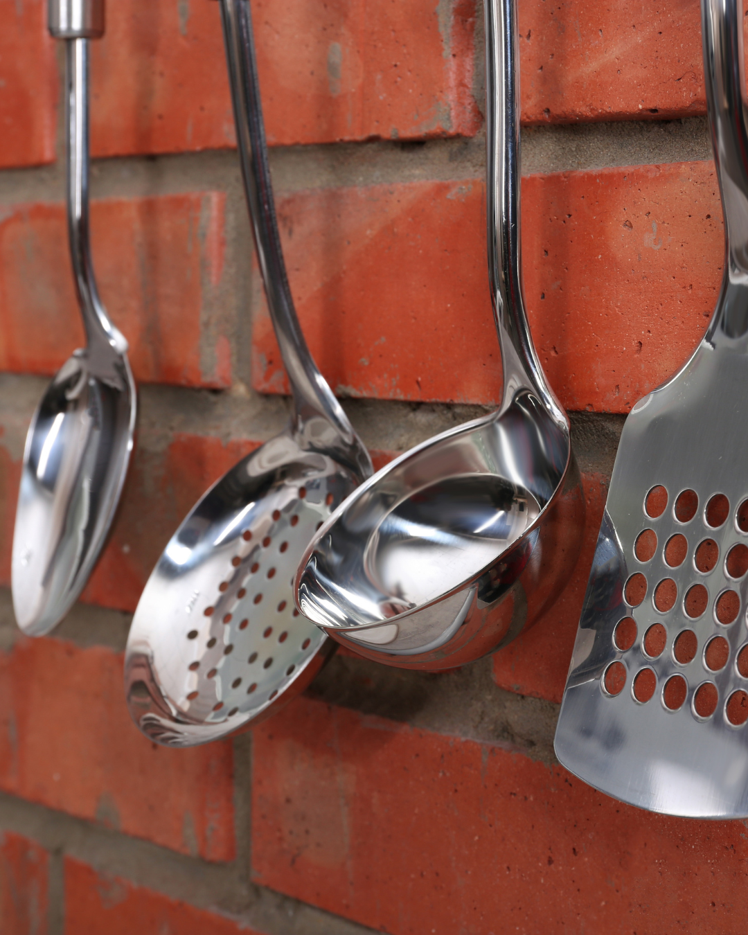 Kitchen utensils for stirring, flipping, and serving.