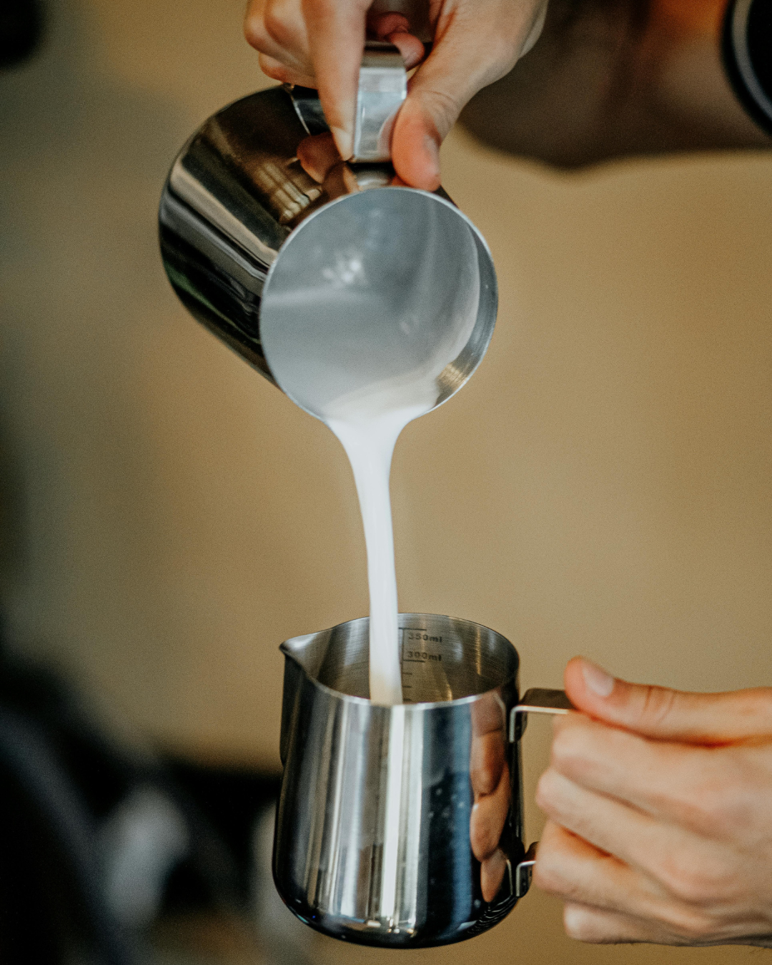 Milk frothing pitchers for coffee drinks.