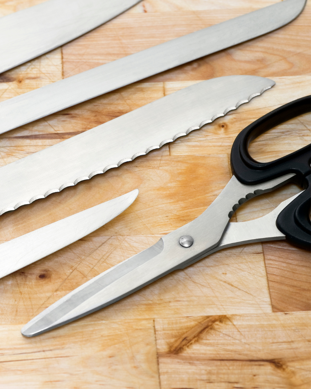 Kitchen knives and scissors for food preparation.