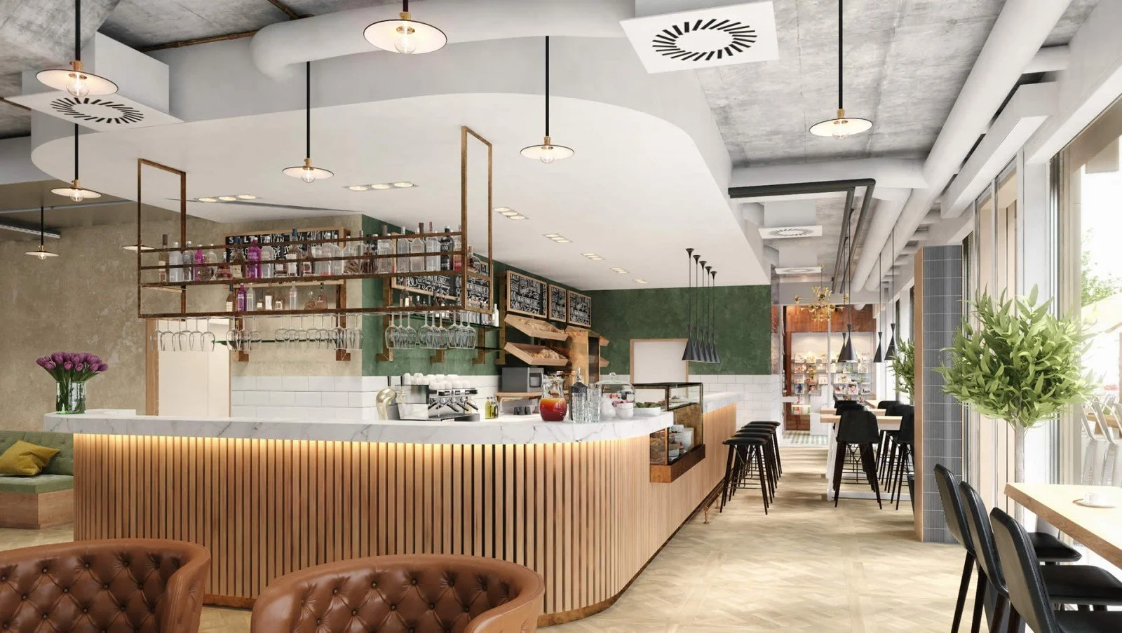 The Studio Kaffee von Ringier - Innenansicht eines modernen, gemütlichen Cafés mit Theke, Barhockern, Tischen, Stühlen und Pflanzen.